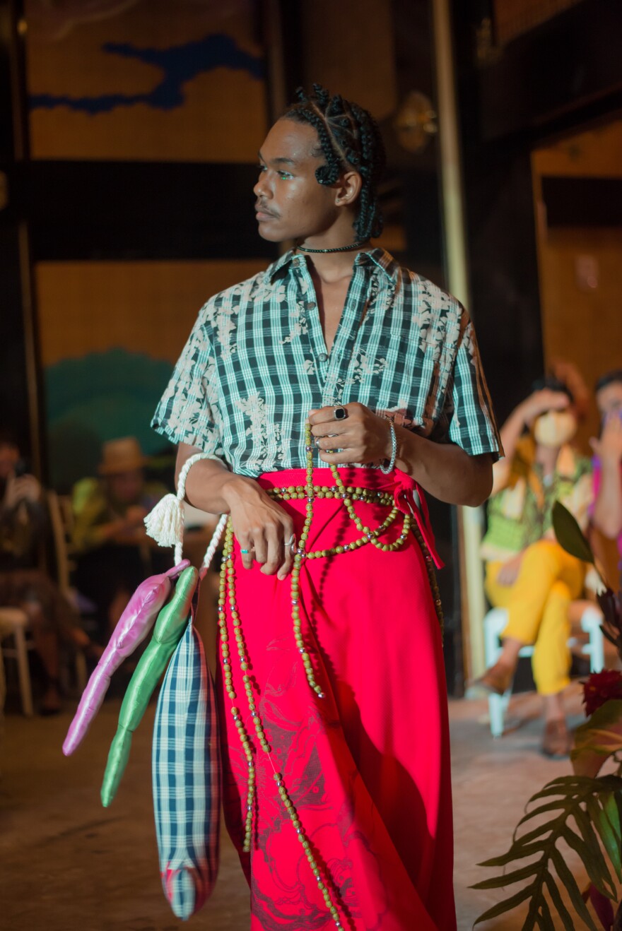 Hawaii fashion designer showcasing traditional Hawaiian-inspired garments